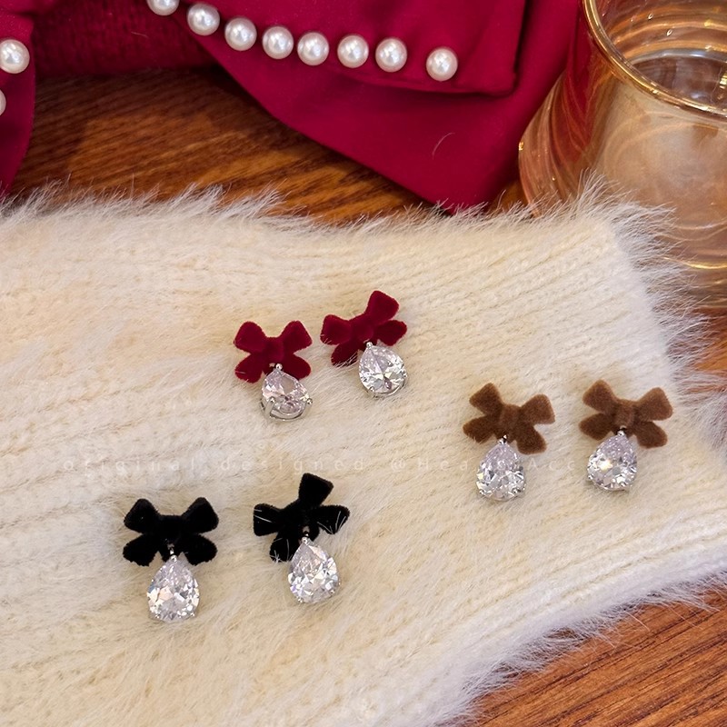 Elegant sophisticated retro earrings with bow with zircon
