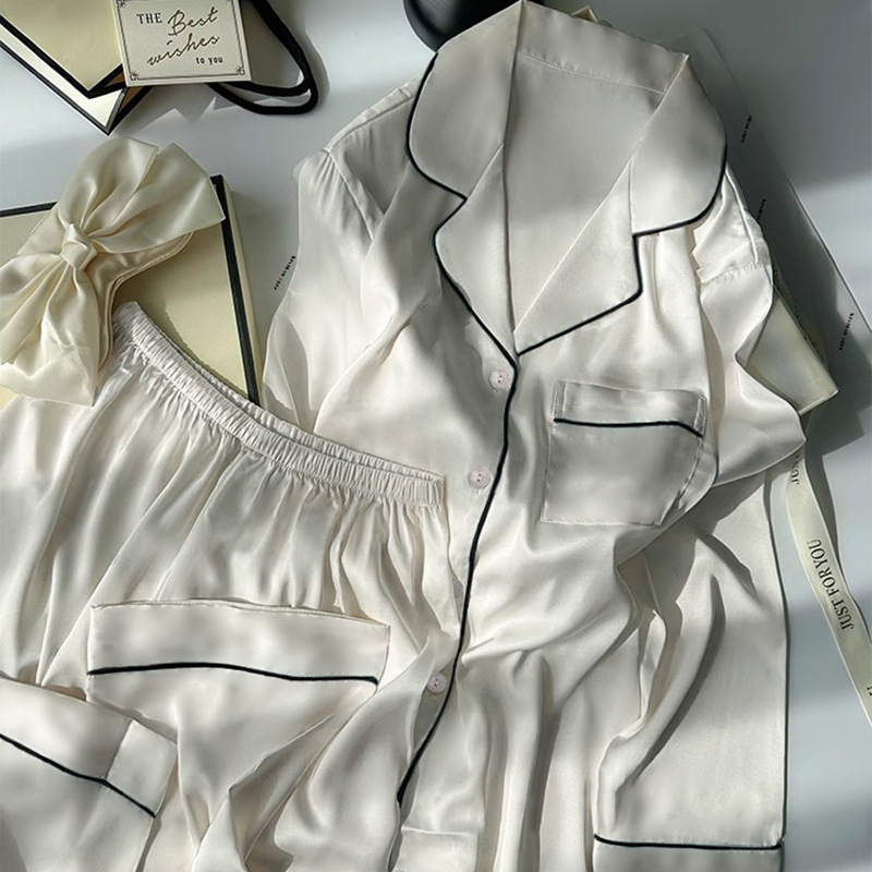 純色のシンプルな氷の女性のパジャマ春と秋の長袖の小さい大衆のプリントの家庭服の2つのセットは実際に卸売りをたたきます。|undefined
