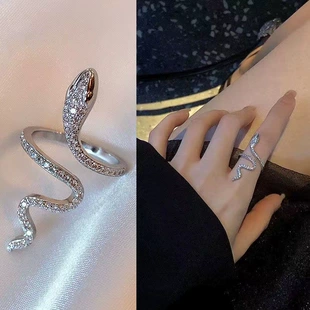 Brand small design ring, on index finger
