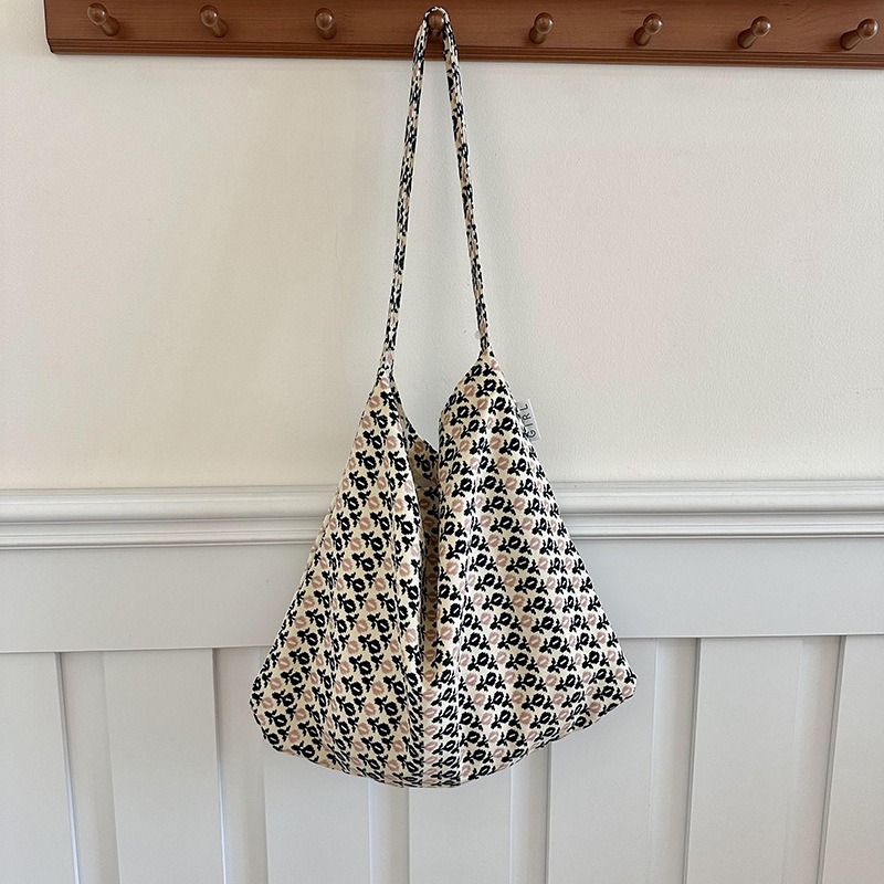 Diseño nicho bolsas de lona para mujeres 2025 nueva gran capacidad coreana estampado de leopardo flor de hombro impresa bolsas de mujer