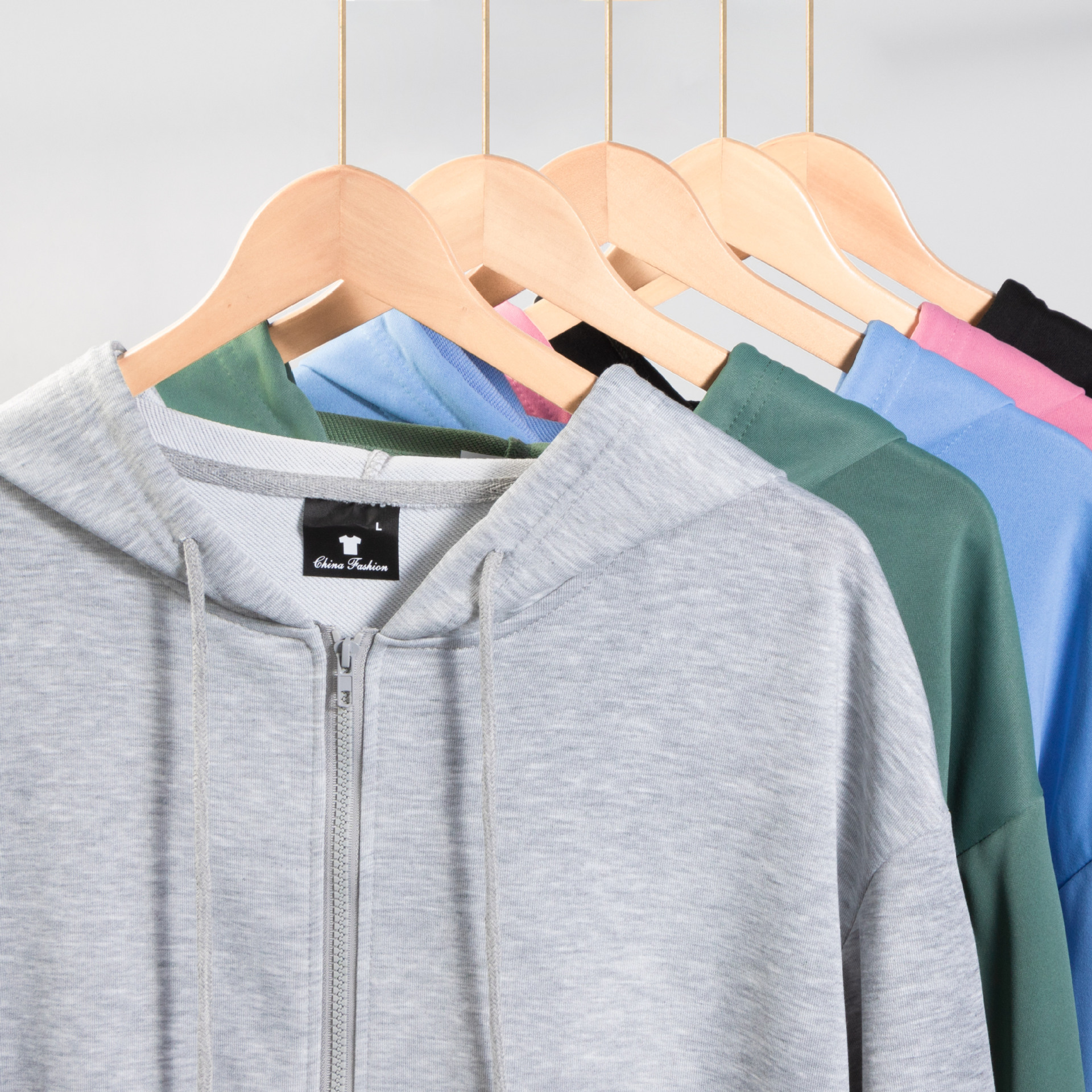 Primavera y otoño cárdigan con cremallera y capucha sudadera fuera del hombro de manga larga color puro Xiyin transfronterizo Temu versión suelta