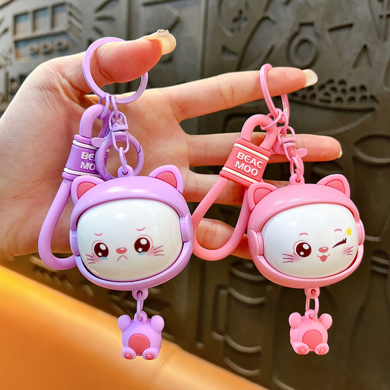 Llavero creativo de dibujos animados girando música lindo descompresión cambio de cara llavero de gato bolsos para hombres y mujeres pequeños regalos al por mayor