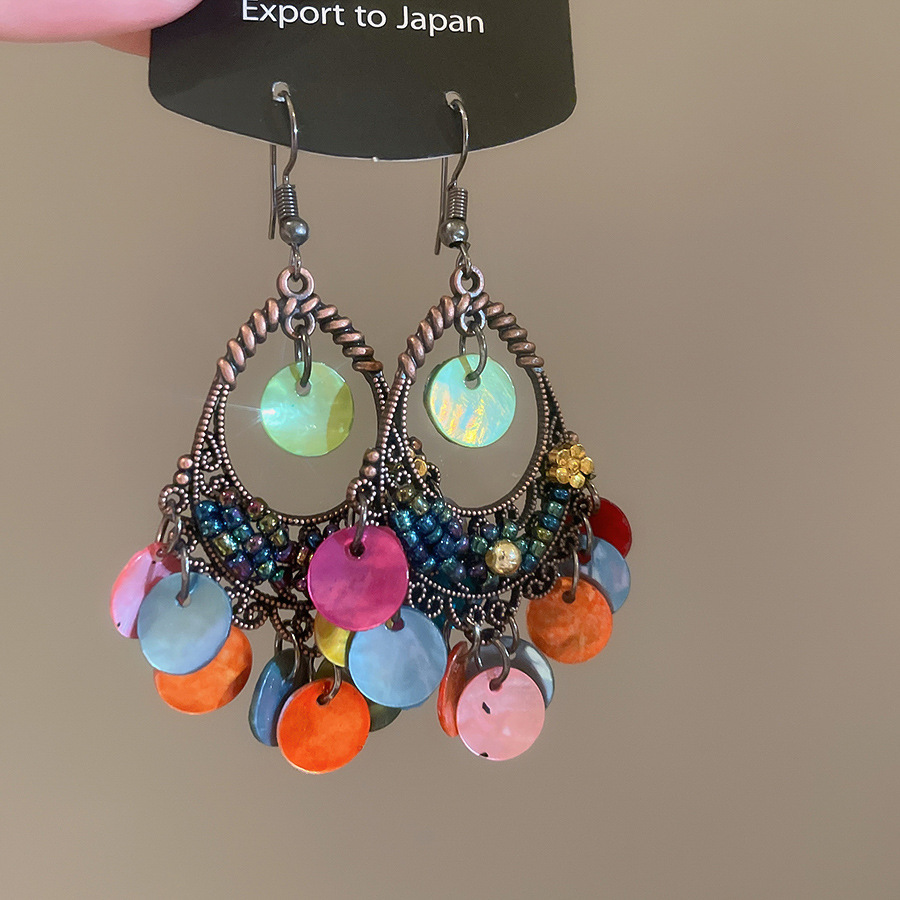 Pendientes de borla de concha geométrica redonda, estilo de vacaciones junto al mar, gancho para la oreja, pendientes de todo fósforo de moda, sentido de clase alta de nicho