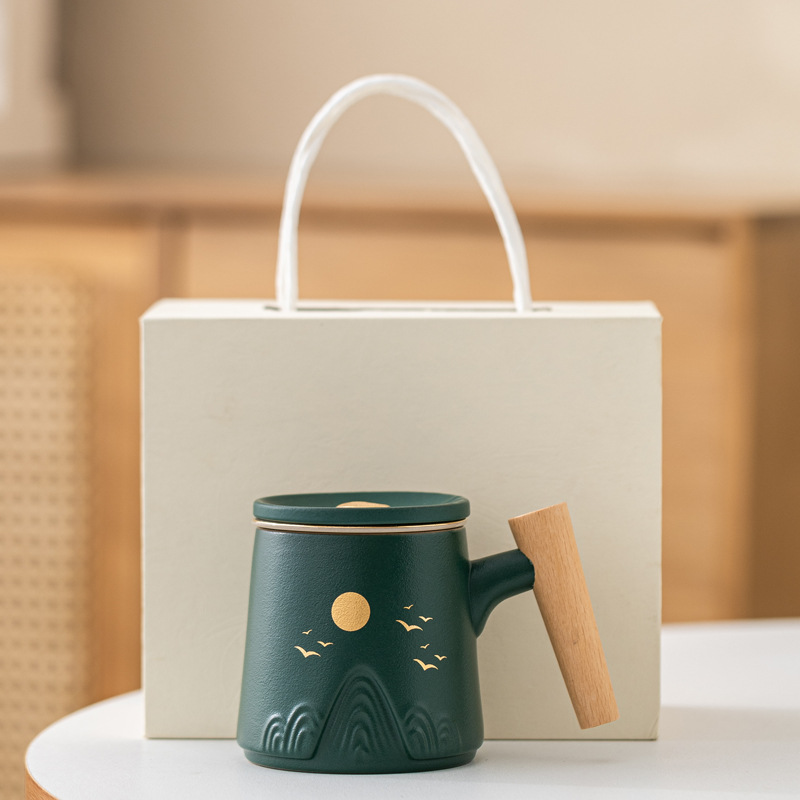 Guofeng Wenchuang marca taza de cerámica Zhoushan tres piezas juego de regalo de mano taza de calentamiento tallado comercial LOGO nombre