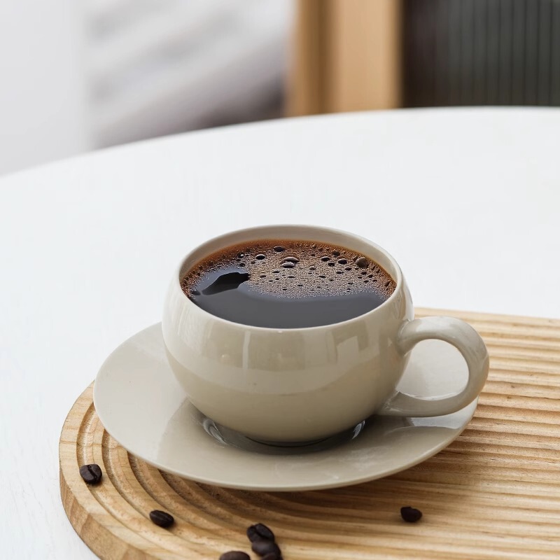 High-Quality Creative Wholesale Sheep Fat Jade Coffee Cup Ceramic Cup and Saucer Set for Home Use, Simple Office Tableware with Natural Ash Glaze