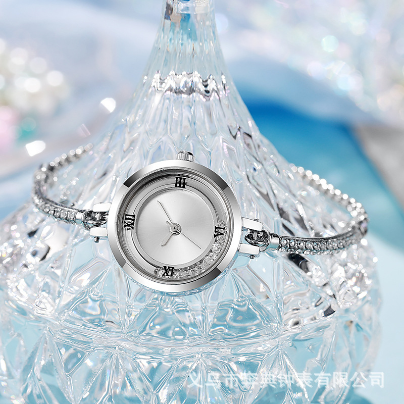 Pulsera literal de diamantes rotos de sensación de nicho de alta gama, reloj, cinturón pequeño, nuevo reloj de mujer de cuarzo de arena movediza de celebridades de Internet al por mayor