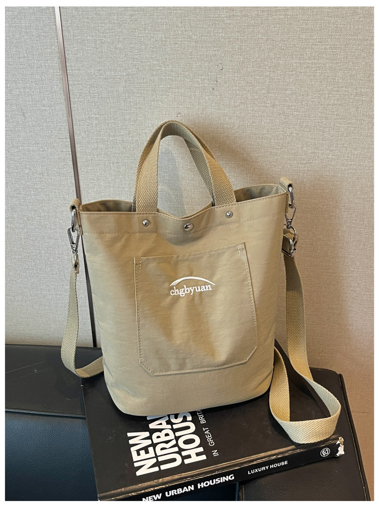 Bolso de mano de gran capacidad para mujeres 2026 verano nuevo estilo coreano simple mochila de hombro de viaje bolsa de ocio