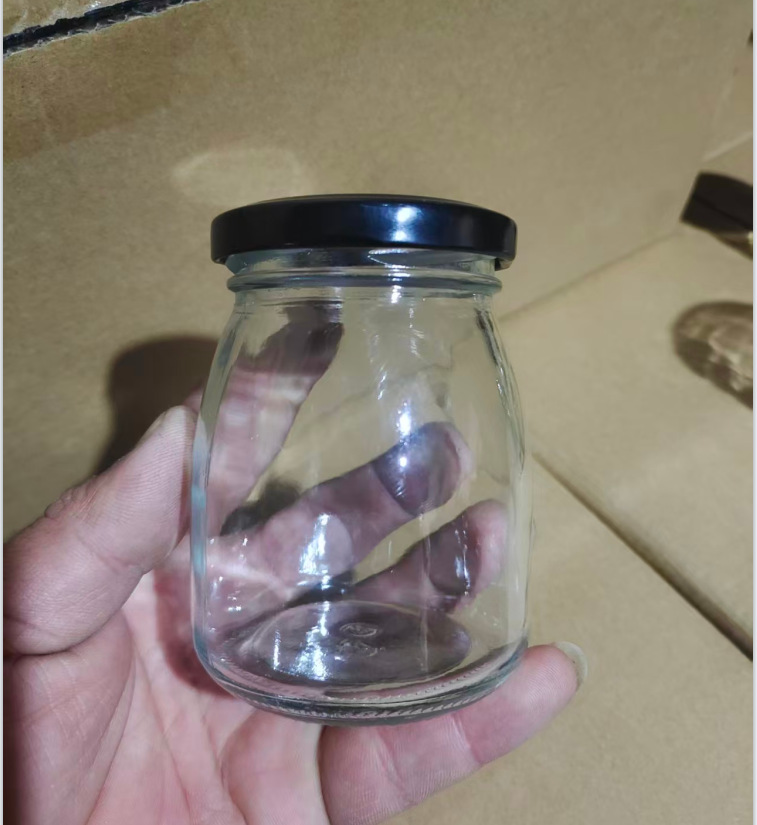 卸売り100mlガラス布丁瓶厚手牛乳カップ耐高温ヨーグルト瓶木栓ガラス瓶許瓶瓶