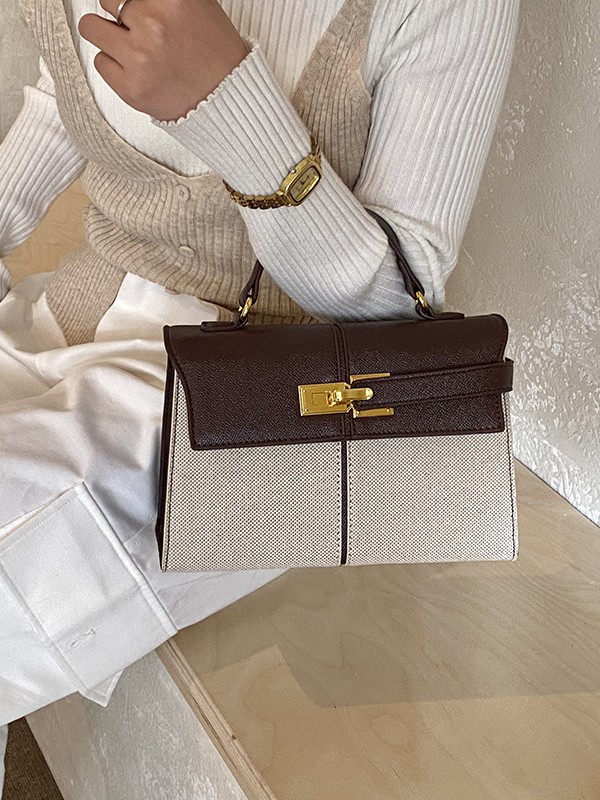 Lujo ligero color contrastante empalme bolso de mano pequeño para mujeres 2026 ventas calientes nueva moda versátil alta sensación mochila