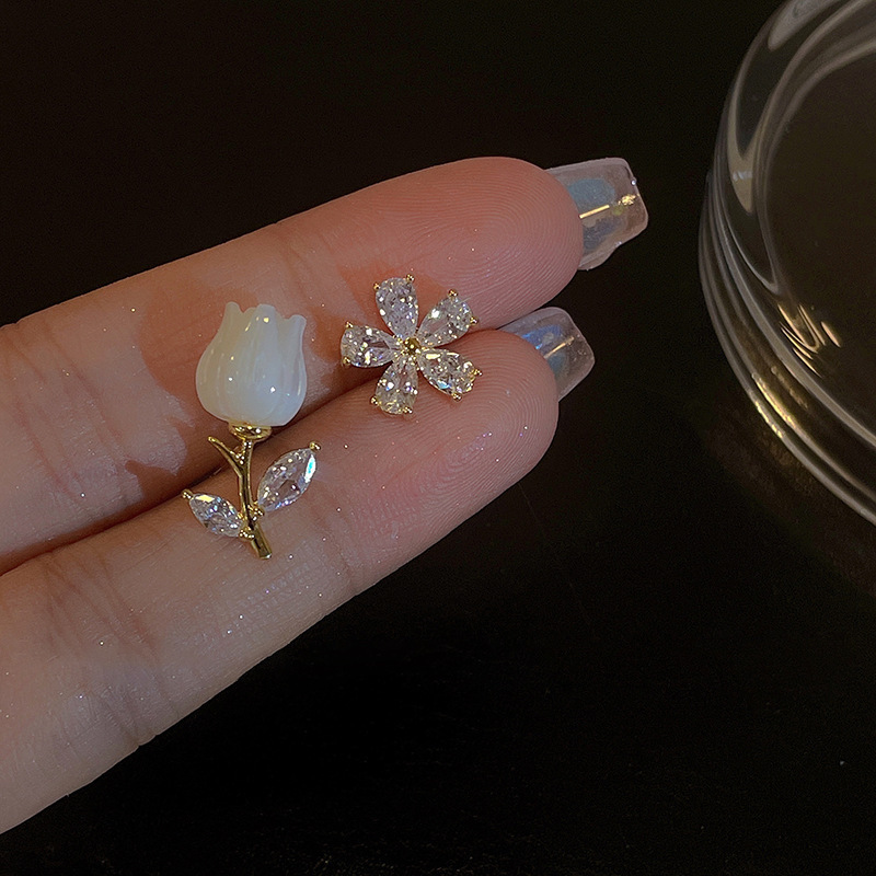 Elegant small design asymmetrical earrings with zircon