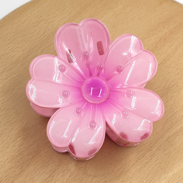 国境を越えたアマゾンの卵の花がグラデーションの花のキャンディー色の紫荊花の後頭部をつかんでサメの花を挟んで髪を伸ばします。|undefined