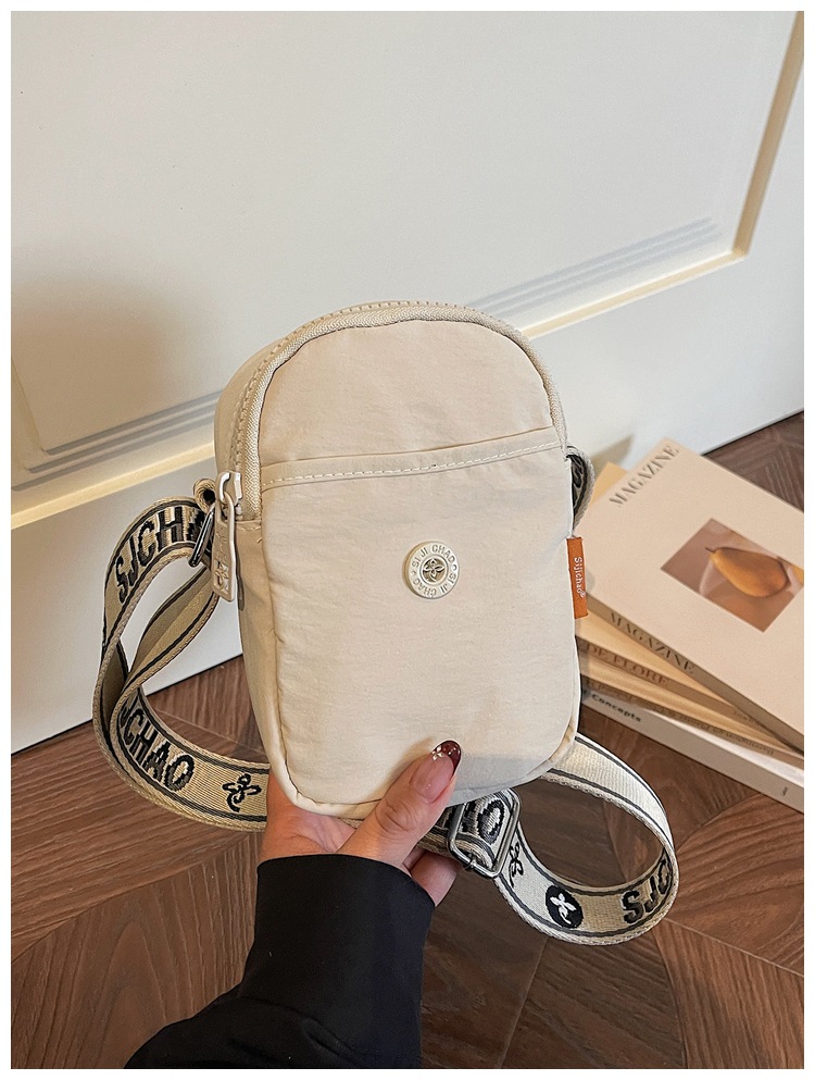 Bolso de nylon de moda para mujeres 2026 nuevo bolso de teléfono móvil ligero casual simple bolso de transporte de viaje