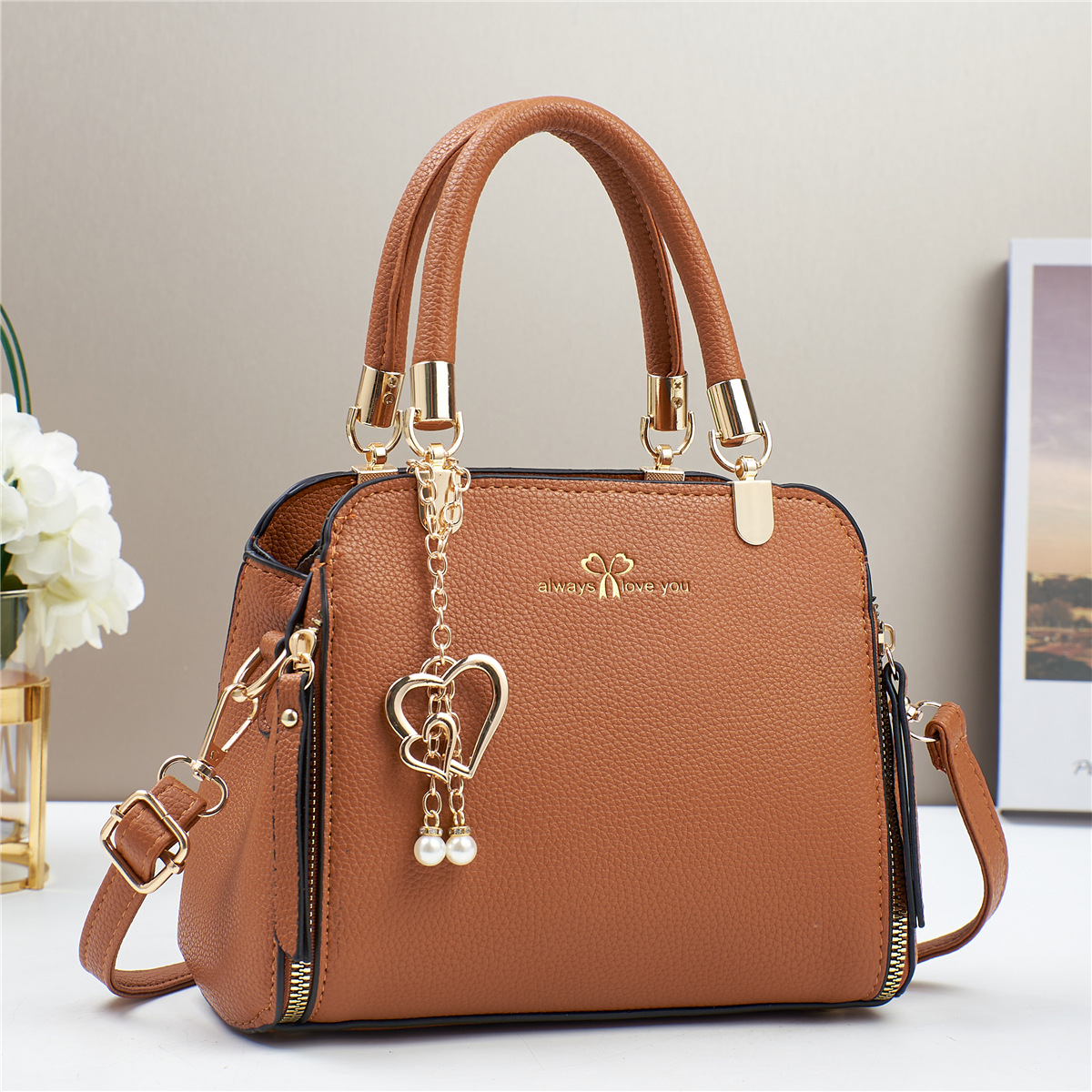 Bolso de mano de explosión bolso de mujer 2025 fabricante de comercio exterior nuevo bolso de hombro de verano atmósfera de moda universal