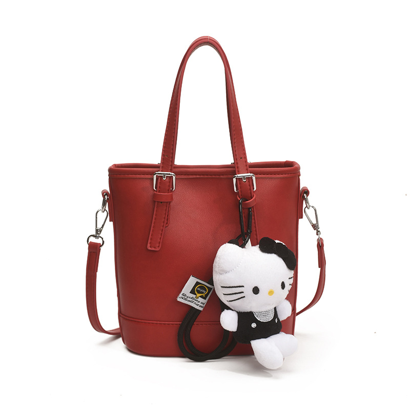 2025 nuevo bolso de cubo portátil de diseño de nicho bolso de hombro de viajero de todo fósforo de moda femenina bolso de mensajero de estilo occidental de color sólido