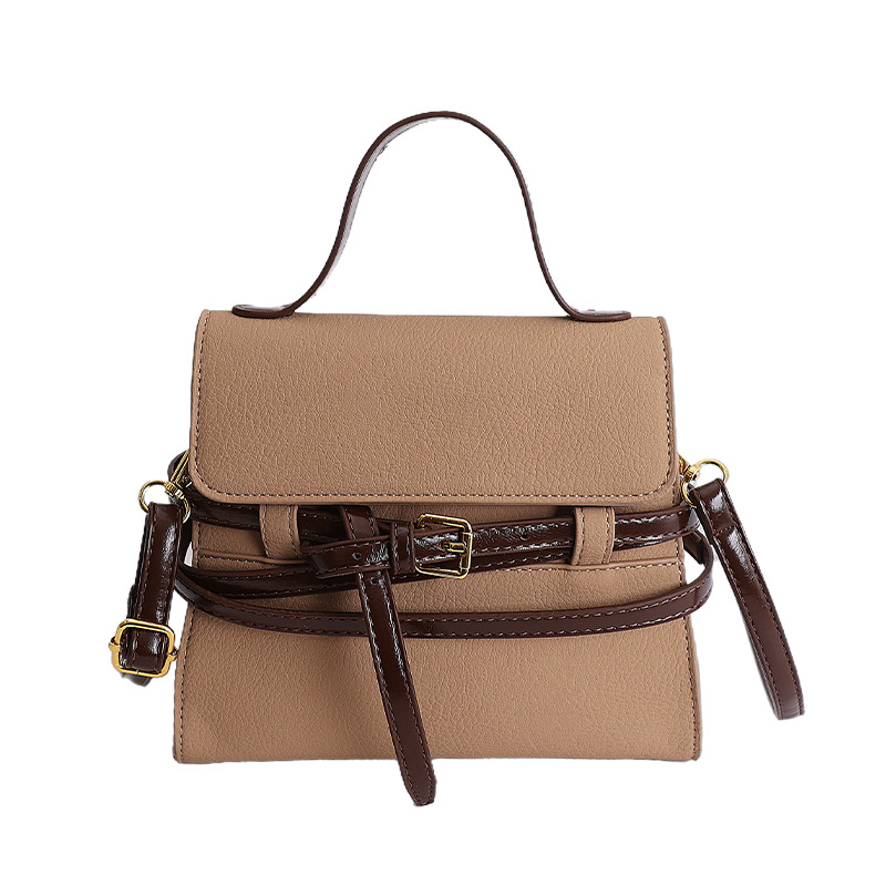 Bolsas de mano de nicho coreano de color contraste para mujeres 2026 primavera textura simple moda diaria correa de hombro mochila