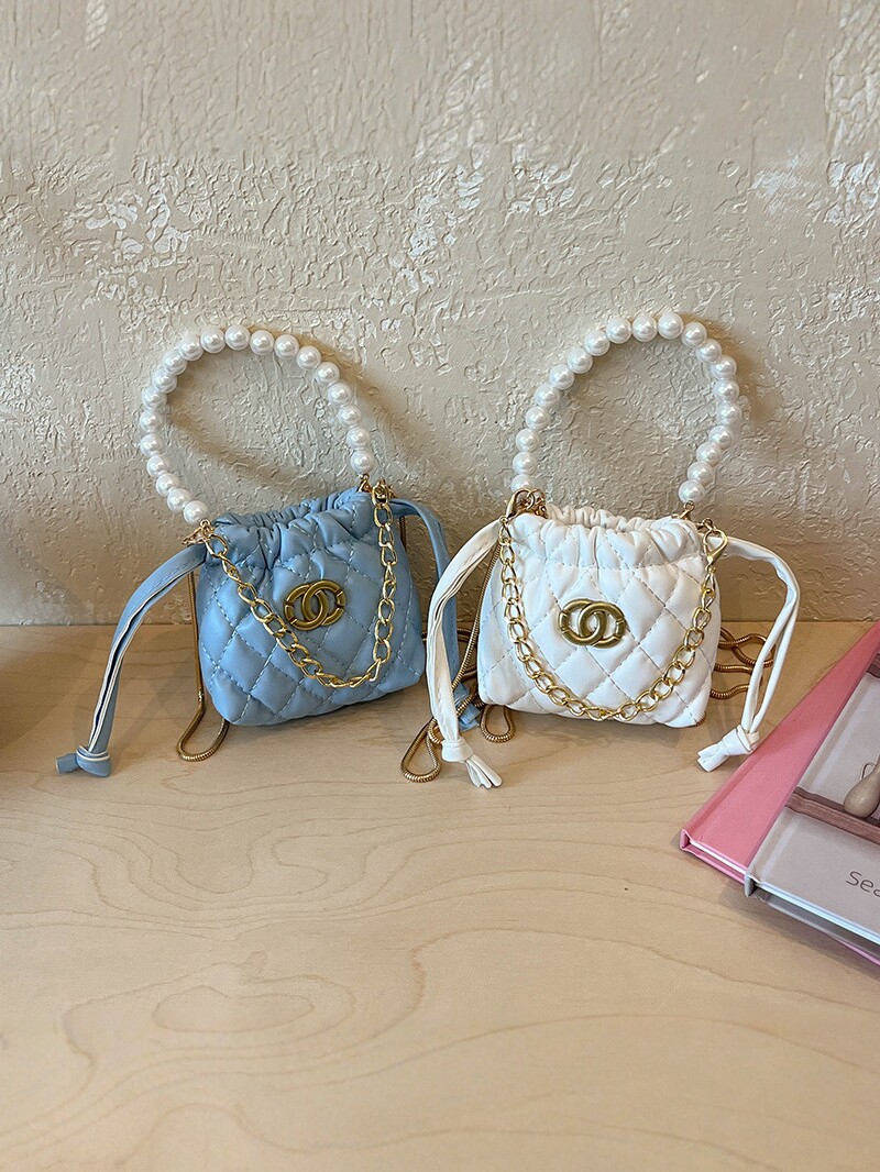 2026 nuevo niño cadena de perlas bolsos de diamante chicas moda mini bolsos de hombro caramelo princesa mochila
