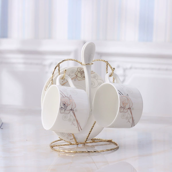 Gold rose two cups and saucer with porcelain spoon and gold peach stand