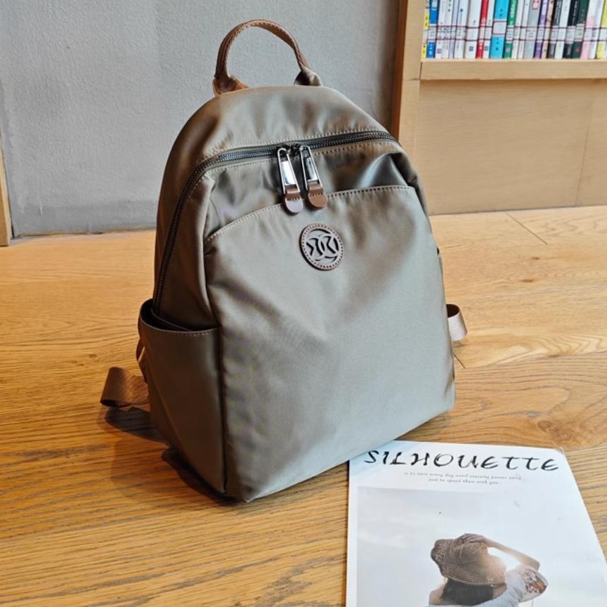 Mochila turística mujer 2024 nueva moda nicho de alta gama ligera bolsa de cercanías mochila de viaje bolsa de mamá