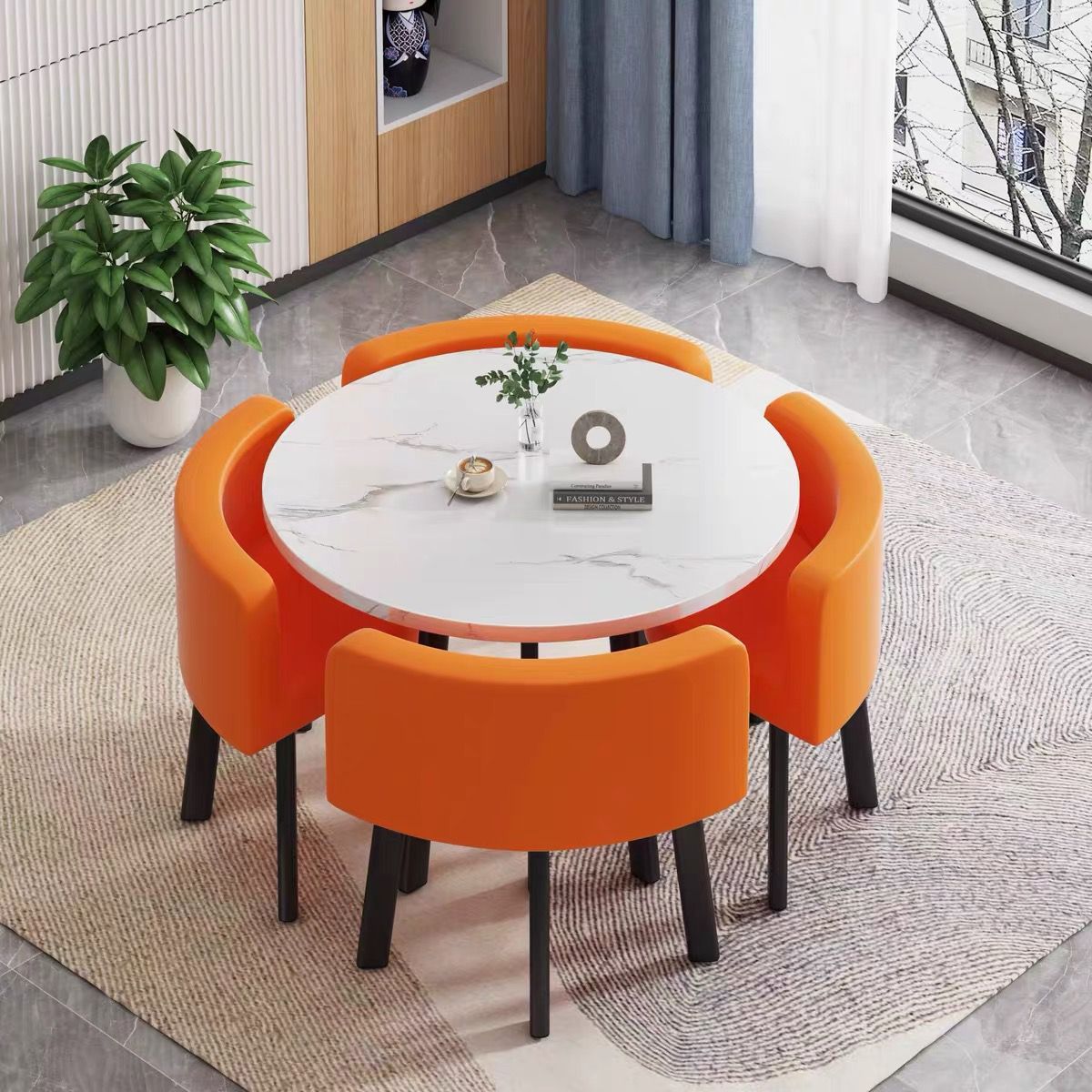 White round table + four orange leather chairs