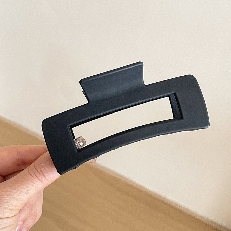 1 # clip cuadrado negro largo 10cm ancho 4.5cm