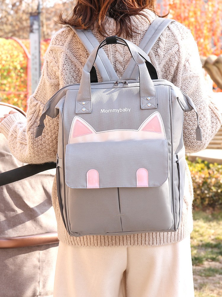 Estilo de gato transfronterizo de buena calidad, bolso de mamá de gran tamaño, mochila portátil, gran cantidad de stock, cremallera Oxford