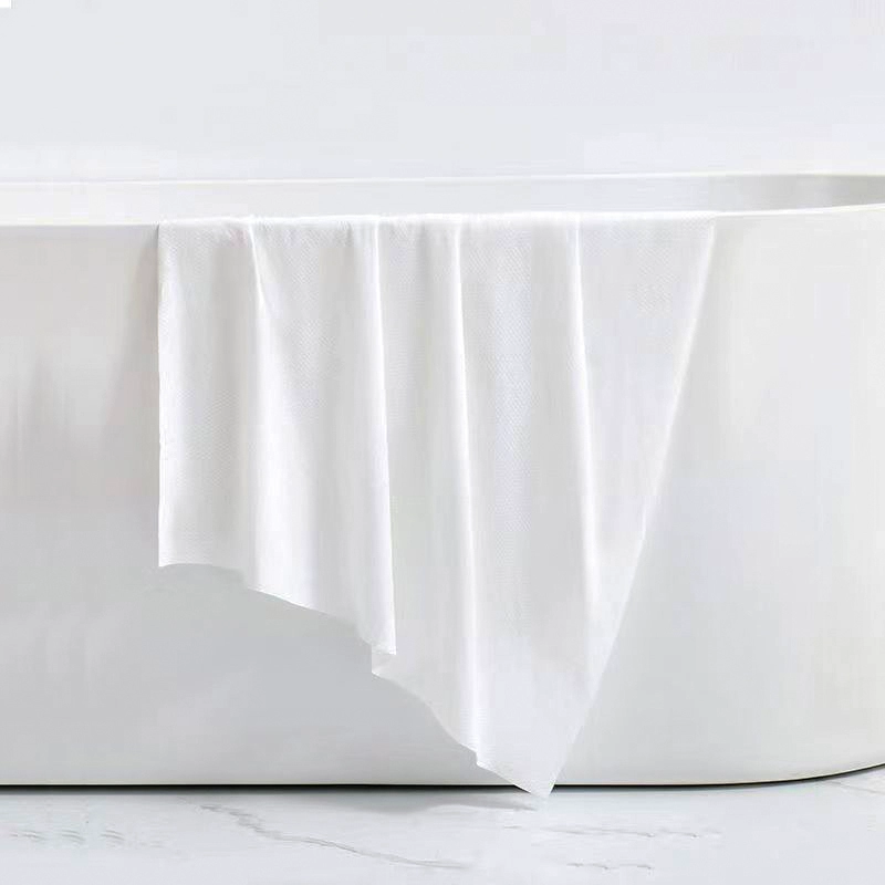 Одноразовое банное полотенце для гостиничного портативного путешествия впитывает воду для купания