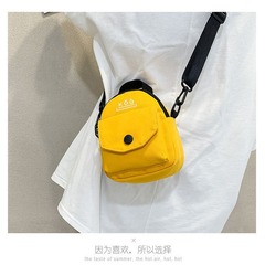 卸売りの多色のキャンバスの小包の肩は斜めに大容量の小さいリュックサックにまたがります。
