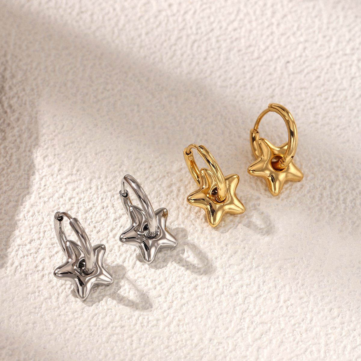 Taina europa y americana auriculares de acero inoxidable lujosos personales estilo de lujo universal estrellas colgantes pendientes de acero de aluminio nicho de alta calidad para mujeres