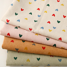 秋冬加厚新款灯芯绒印花布 经典爱心条绒布 女童背心裙灯芯呢面料