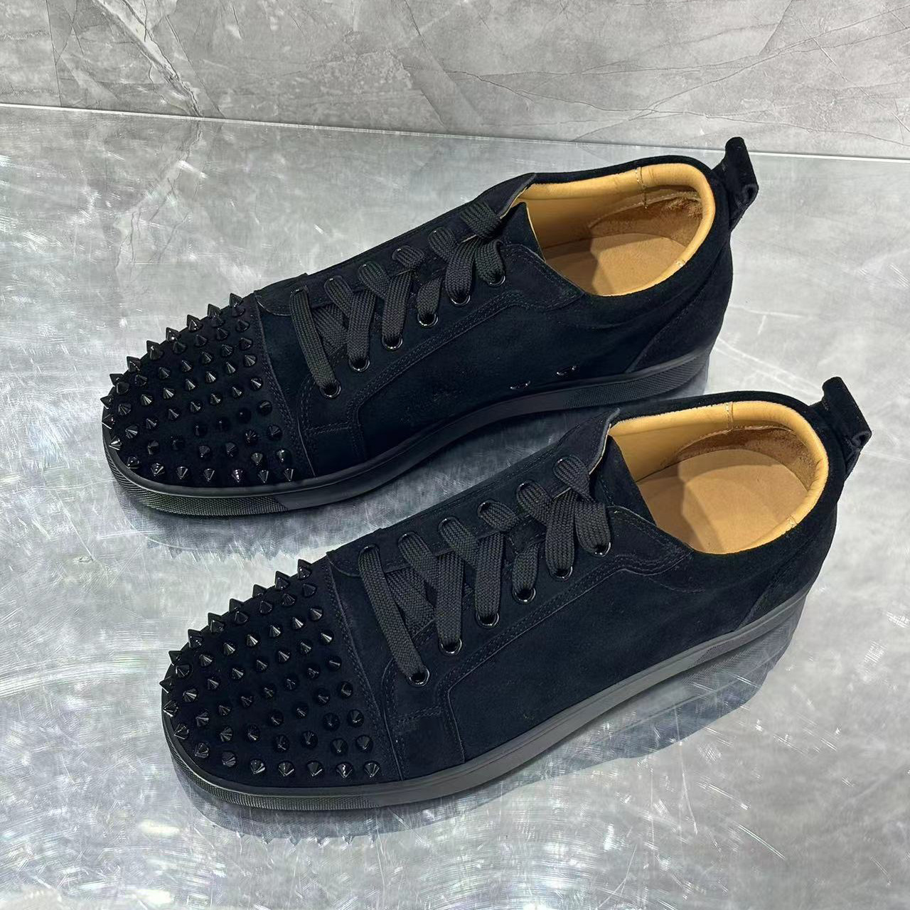 Europa y los Estados Unidos comercio exterior zapatos rojos remachos zapatos de hombre tacos de pareja zapatos casuales de moda zapatos casuales zapatos casuales