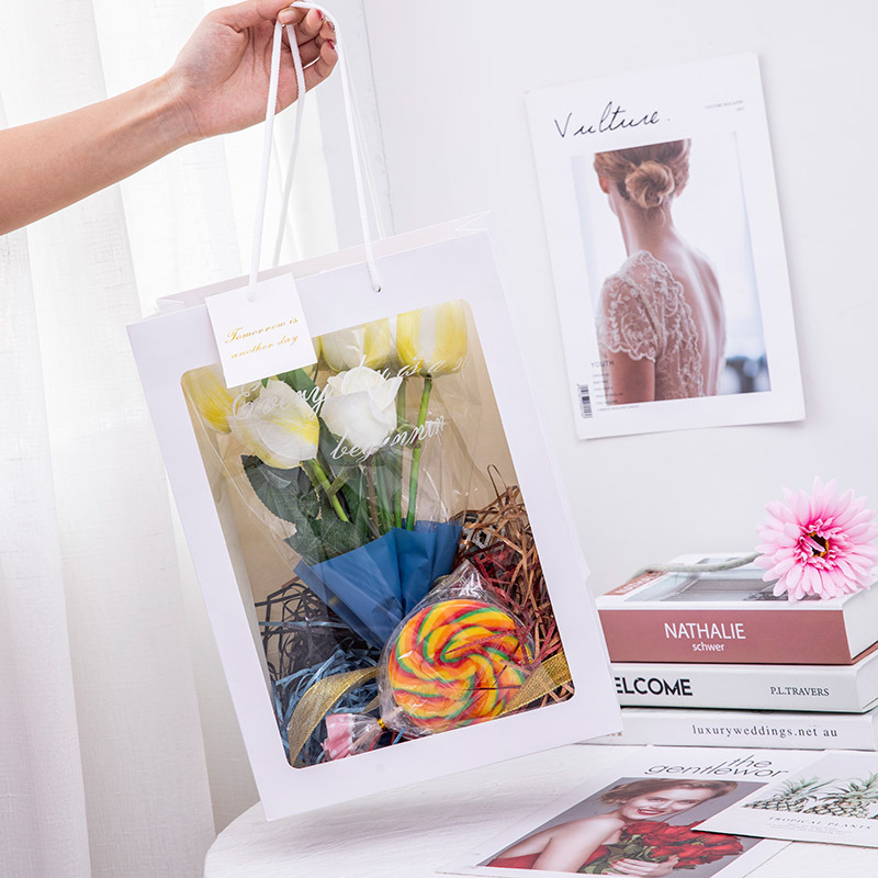 Bolsa de ventana pequeña ins regalo ramo bolsa de embalaje bolsa de papel de flores bolsa de regalo de mano bolso de regalo transparente al por mayor