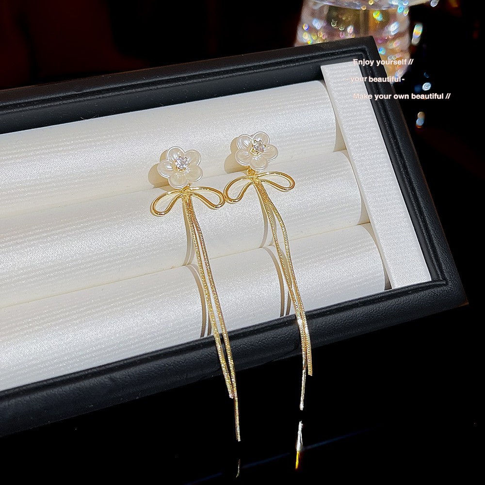 S925 aguja de plata elegante borla pendientes de alta gama simple cara de adelgazamiento pendientes de todo fósforo estilo coreano nuevos pendientes de moda al por mayor