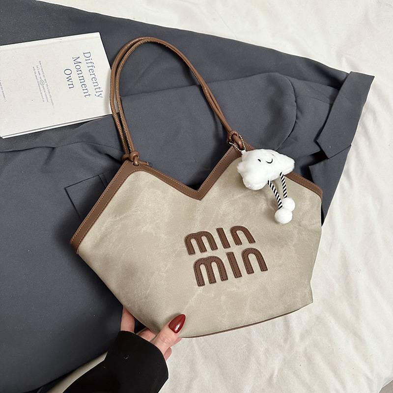 2024 nueva bolsa de gran capacidad para mujeres, bolso de hombro Sen Meng, bolso de diseño de nicho, bolso de viaje de alta calidad para mujeres