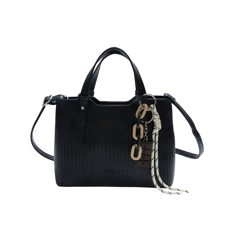 Texturas casuales bolsas de mano para mujeres otoño y invierno 2025 nueva moda simple bolsas de hombro versátiles retro mochila