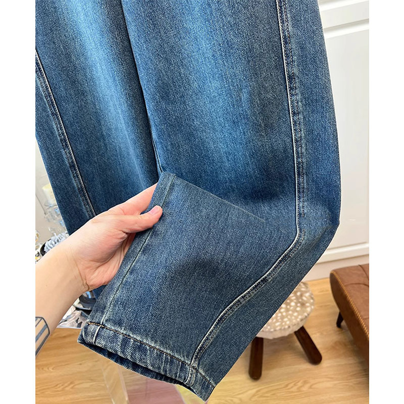 深セン2025の新型の南油の婦人服のヨーロッパの商品のアメリカの復古の水洗いはレジャーの曲がった刀の広い足のジーパンの女性をつなぎ合わせます。