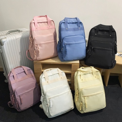 学生书包休闲双肩包轻便女生手提包潮流旅行大容量背包时尚电脑包