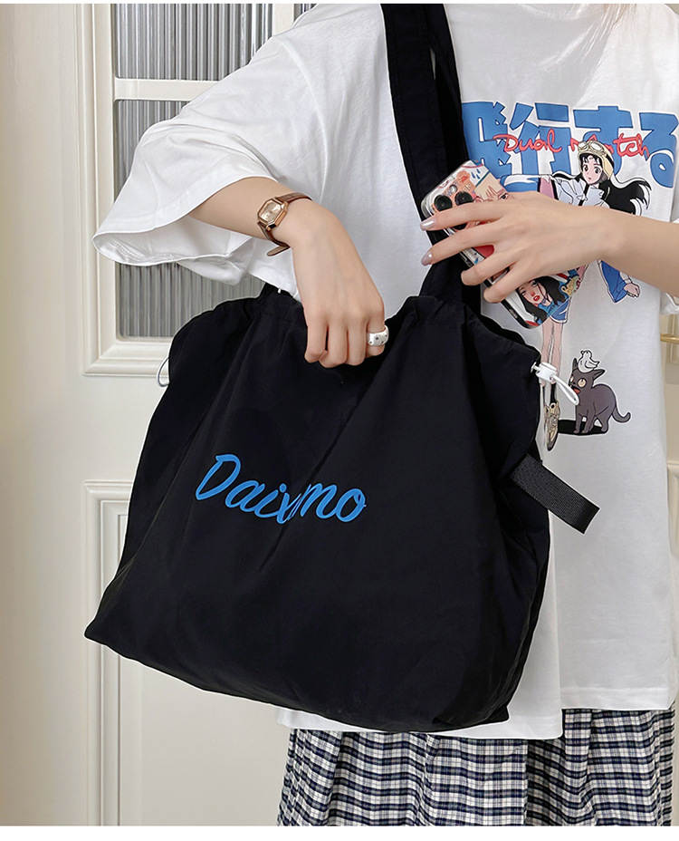 Solid color large-capacity tote bag 2025 bestseller, fashionable commuting lightweight handbag, laid-back style drawstring nylon bag for women undefined