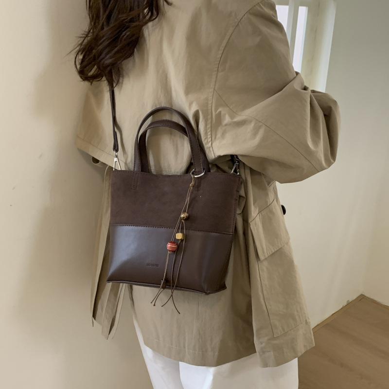 Bolso de moda transfronteriza retro bolso de cubo de agua mujer otoño y invierno 2025 nuevo estilo versátil bolso de hombro de viaje