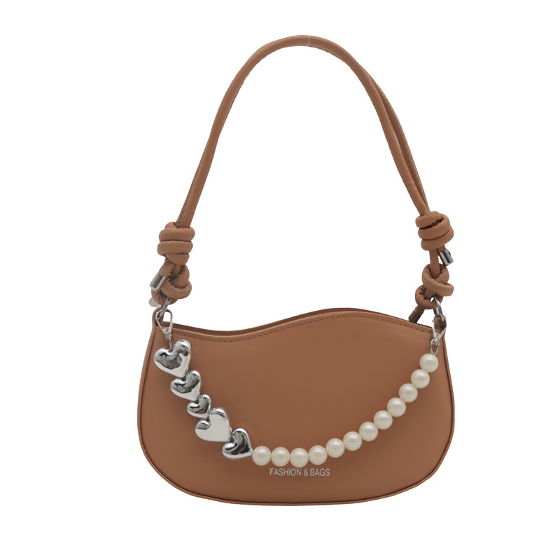 Tendencia de este año 2024 nueva tendencia de perla de viaje de hombro simple moda europea y americana bolso de mano para mujeres