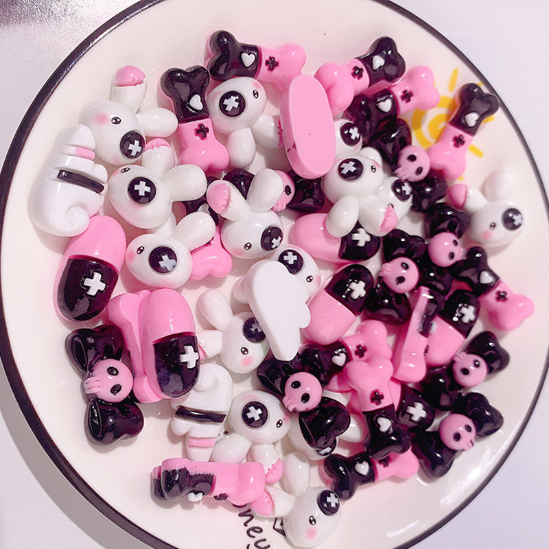 Caricatura dulce serie cool cráneo arco accesorios de resina DIY pegamento crema caja de teléfono móvil adornamiento de cabello agujero botón de zapato