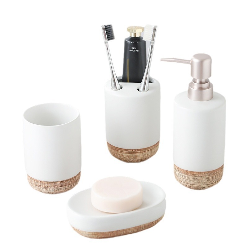 Kit de lavado de lujo ligero botella de embalaje de madera blanca pura botella de emulsión de baño de cerámica de baño de cuatro piezas