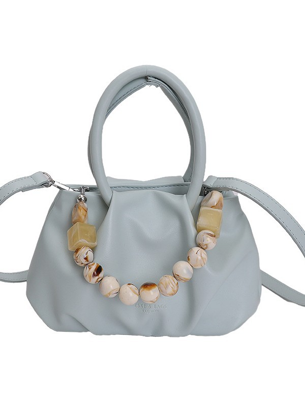 Alta sensación de mano pliegueada nube bolso de cubo para mujeres 2026 nuevo nicho de lujo ligero de moda perla bolsa de mochila