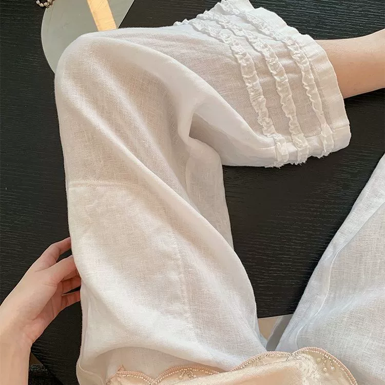 Удобные прямые повседневные брюки из хлопка и льна с рюшами для женщин, новый летний стиль, универсальные белые укороченные широкие брюки.