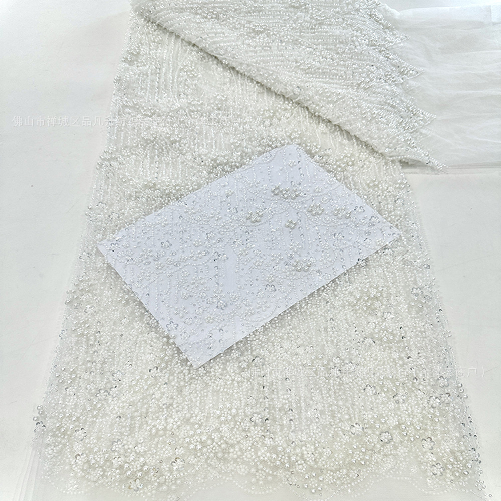 Tejido bordado de tubo de perlas Gao Ding vestido de boda hermoso vestido de rendimiento ropa de moda tela cadena de perlas encaje en stock