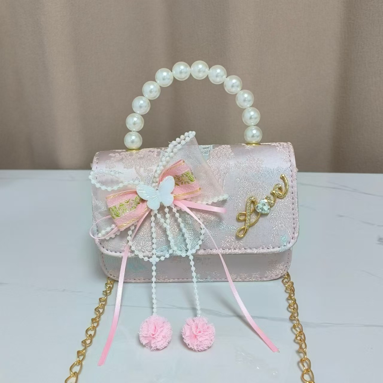 Bolsos infantiles de alto nivel antiguo bolso de cambio de niña pequeña princesa de perlas accesorios de ropa Han bolso de almacenamiento