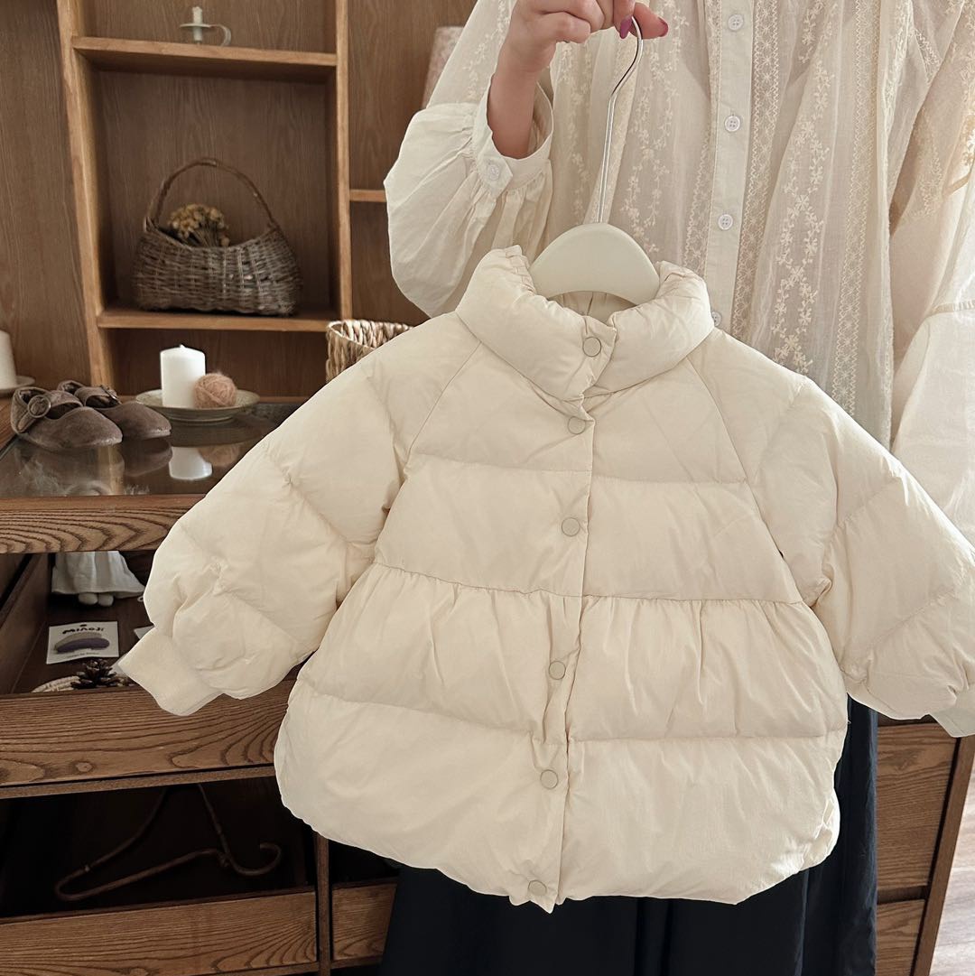 Chica de Qianqiu, ropa de algodón de invierno de nuevo estilo, ropa de algodón de pluma suelta y gruesa para niños