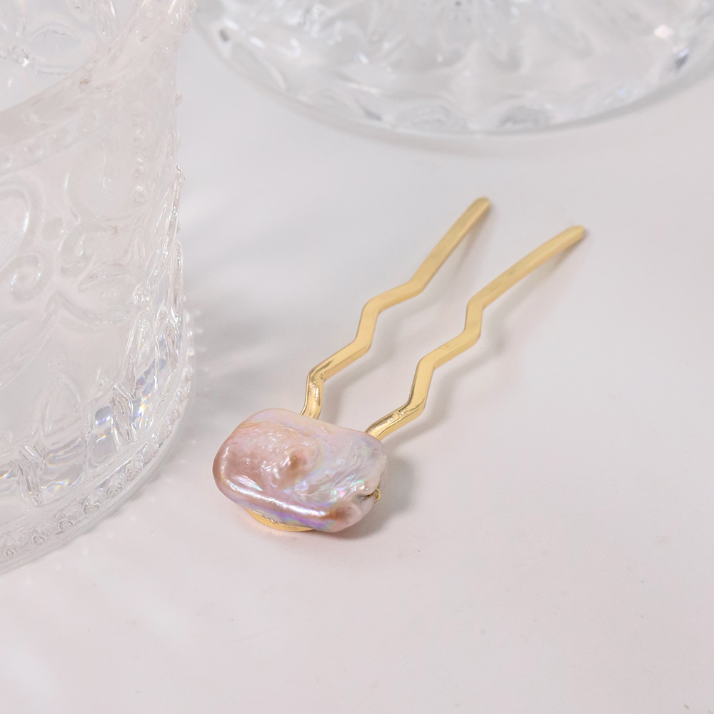 Perla de alta sensación en forma de U clip de cabello bola cabeza fija artefacto clip de cabello nuevo peine de cuatro dientes joyas al por mayor