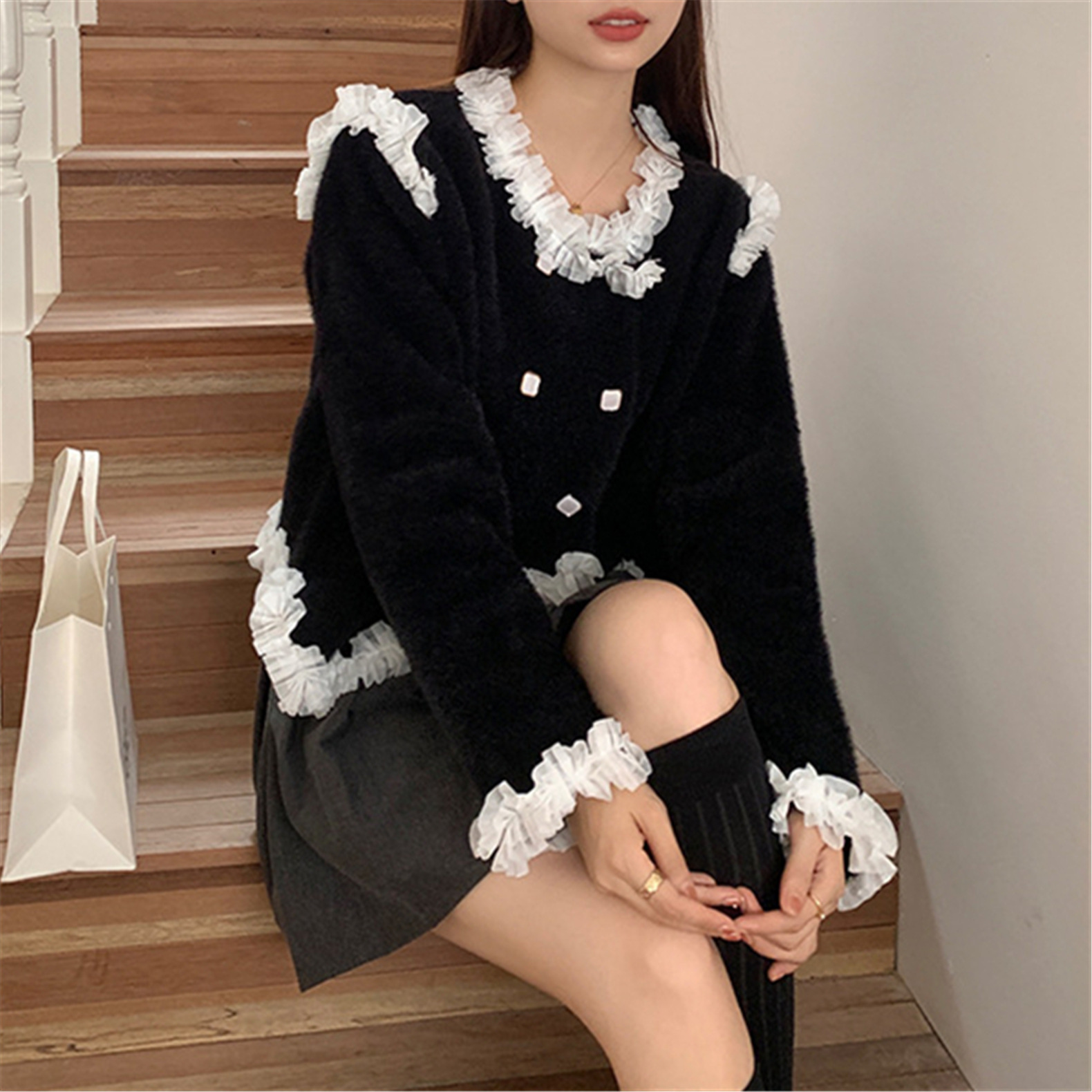 24 invierno Puyuan encantador viento fresco dulce imitación de cardigán de visón cuello redondo suelto camisa de estilo de mujer
