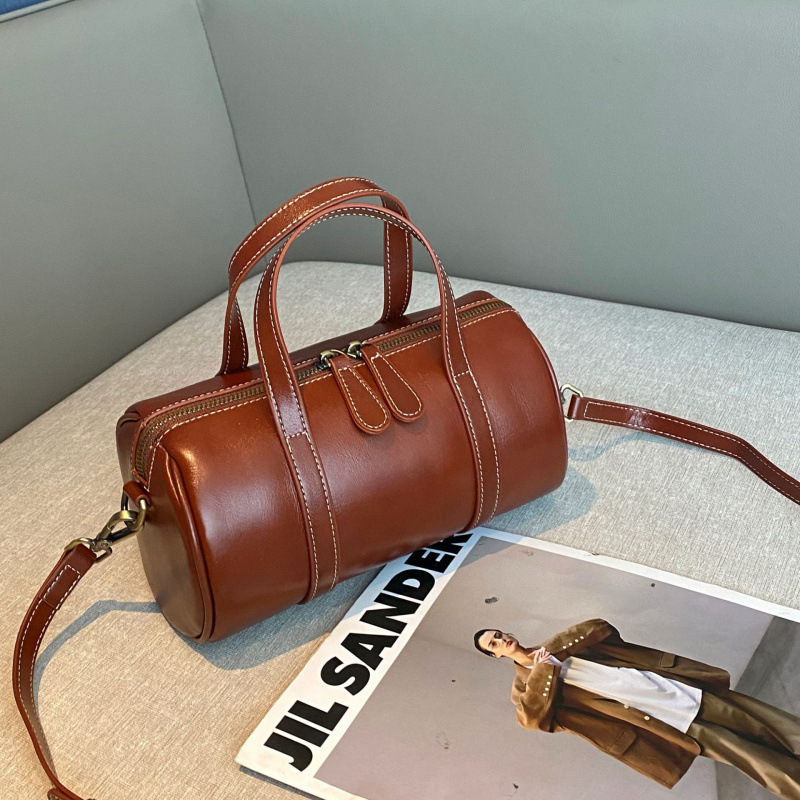 植なめしの上の牛革の枕の包みの女性の高級感の百合の小さい大衆のハンドバッグの女子学生のファッションのボストンバッグの女性