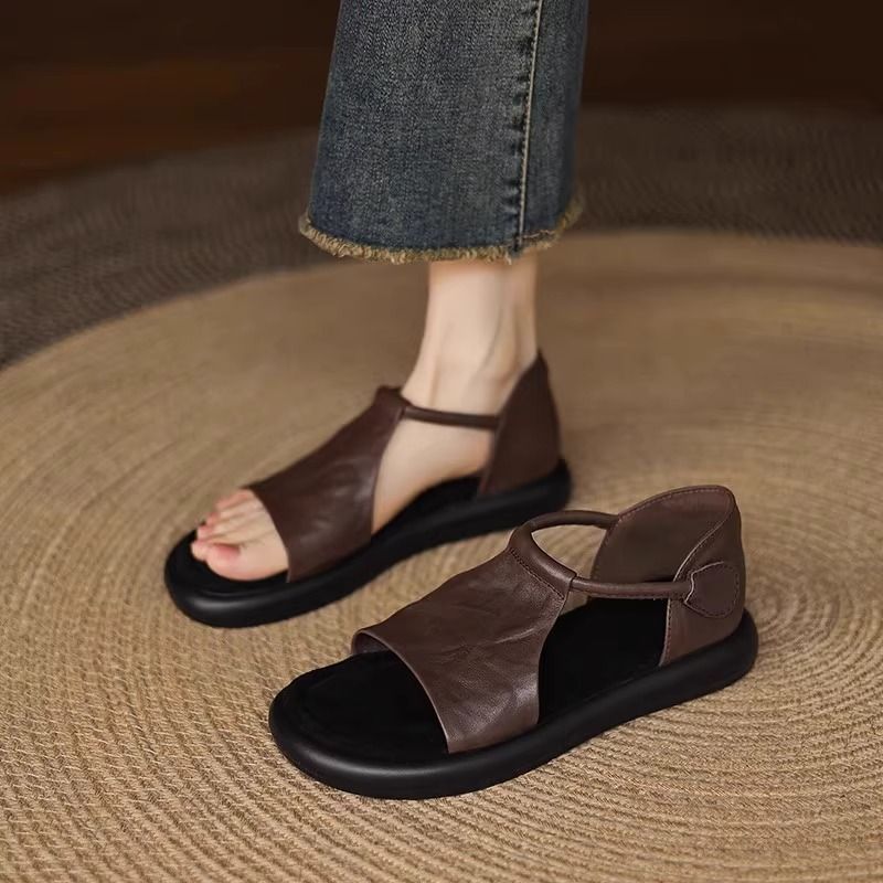 Nicho retrógrado sandalias de dedos desnudos para mujeres de verano 2026 nuevo hueco casual cómodo zapatos romanos planos